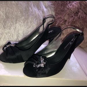 I am selling an elegant black Suede pair of heels